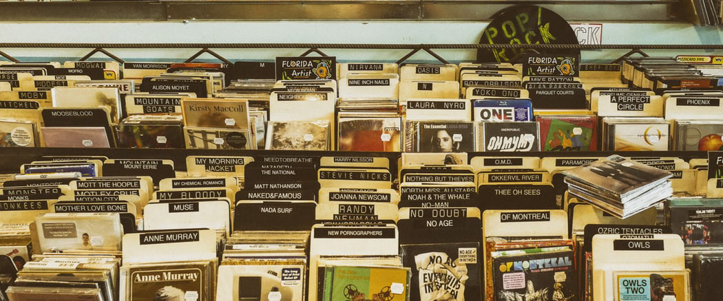 Photo of a CD stand in a record store.